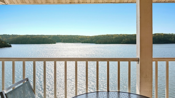 A balcony with a view of a lake and forest. - WorldMark Lake of the Ozarks (Osage Beach)
