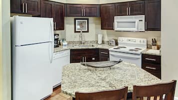 Fridge, microwave, coffee/tea maker, cookware/dishes/utensils