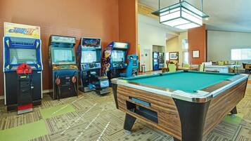 Enjoy games and entertainment in this vibrant space with a pool table and arcade machines.
