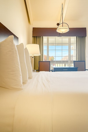 Deluxe Room, 1 King Bed, Harbor View | 1 bedroom, desk, blackout drapes, iron/ironing board