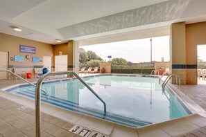 A hotel pool area with a sign indicating no lifeguard on duty. - Drury Inn & Suites Montgomery (Montgomery)