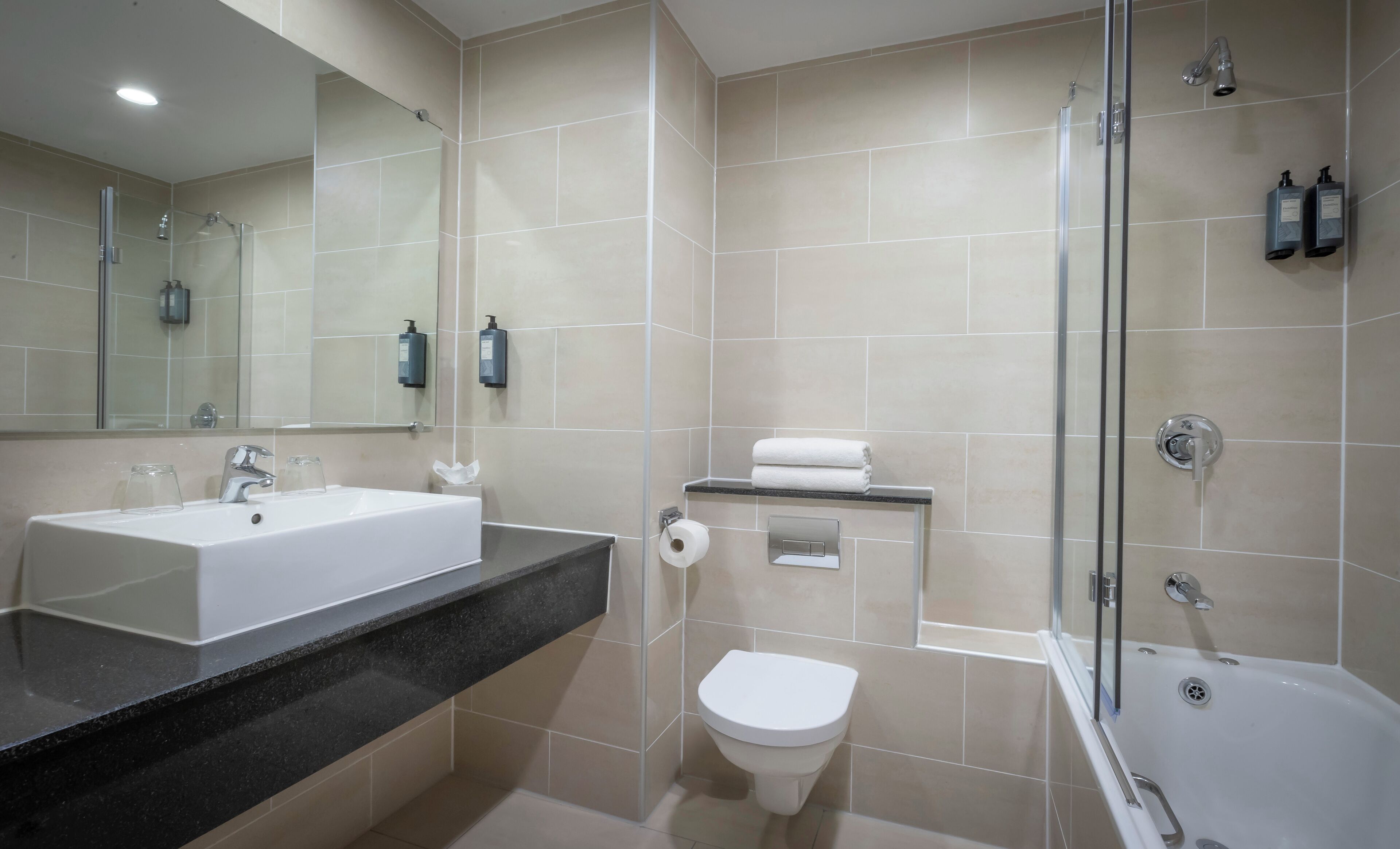 hydromassage showerhead, eco-friendly toiletries, hair dryer, towels