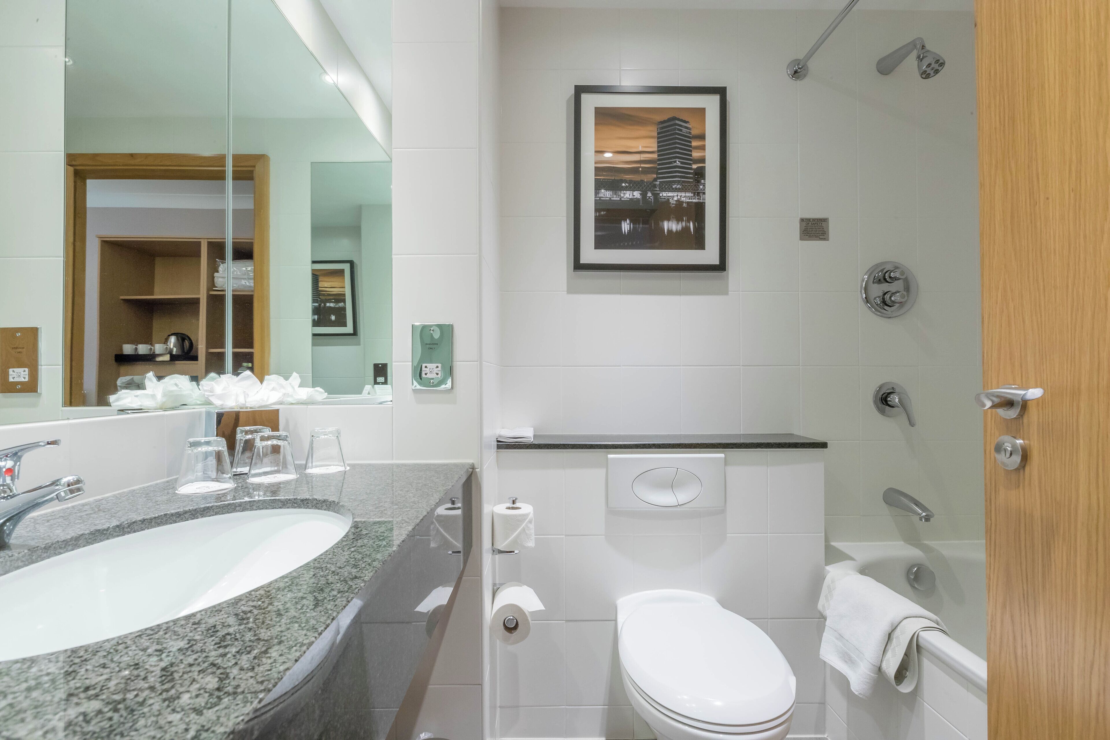 hydromassage showerhead, eco-friendly toiletries, hair dryer, towels