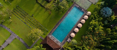 2 outdoor pools, open 7:00 AM to 7:00 PM, pool umbrellas, pool loungers