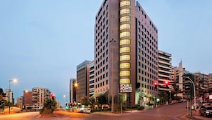 A tall hotel with a prominent 'Four Points by Sheraton' sign, multiple floors, and a modern architectural design. - Four Points by Sheraton Le Verdun (Beirut)