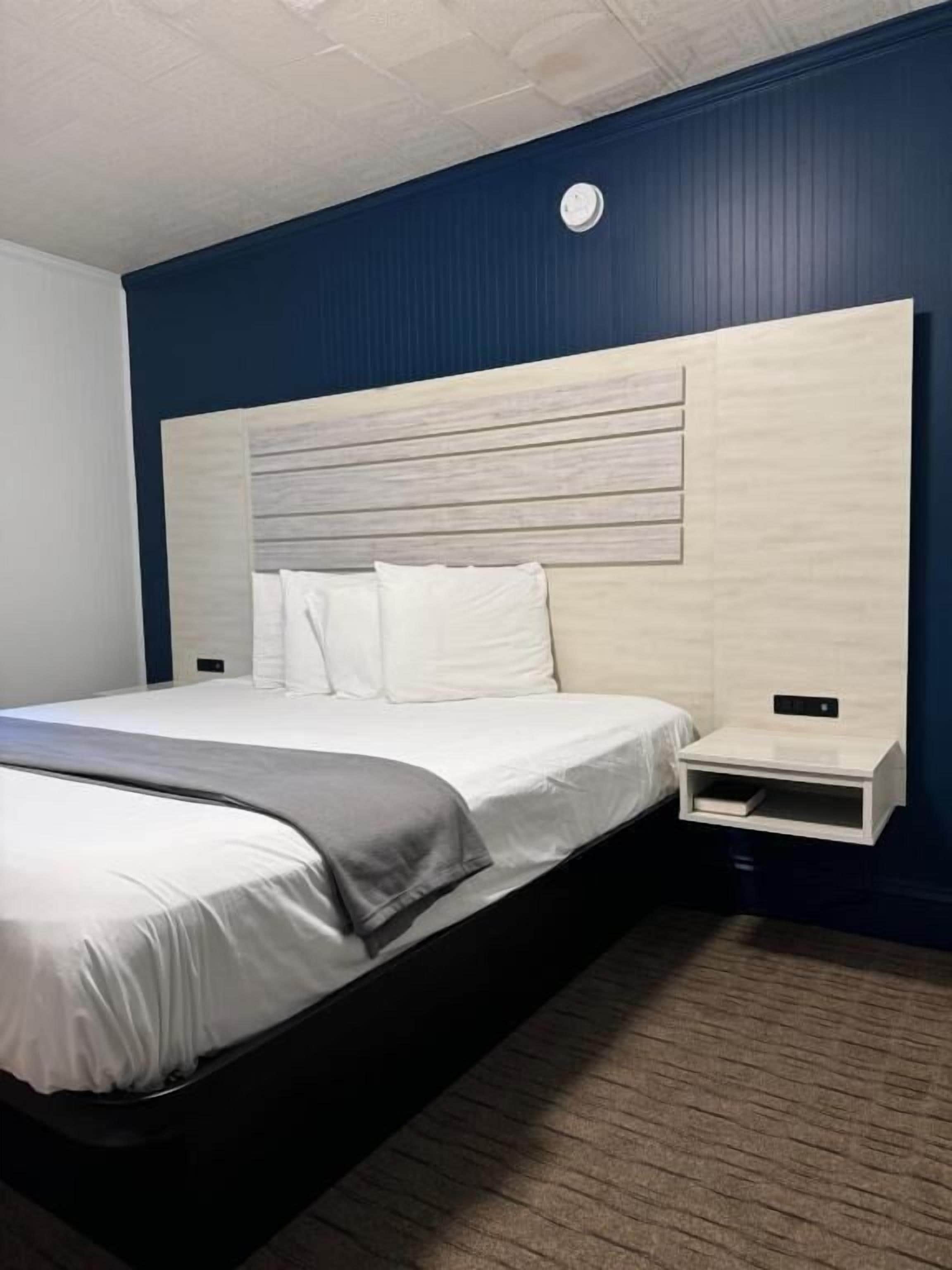 Blackout drapes, iron/ironing board, WiFi (free), alarm clocks