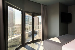 Junior Suite, Terrace | Minibar, in-room safe, blackout drapes, iron/ironing board