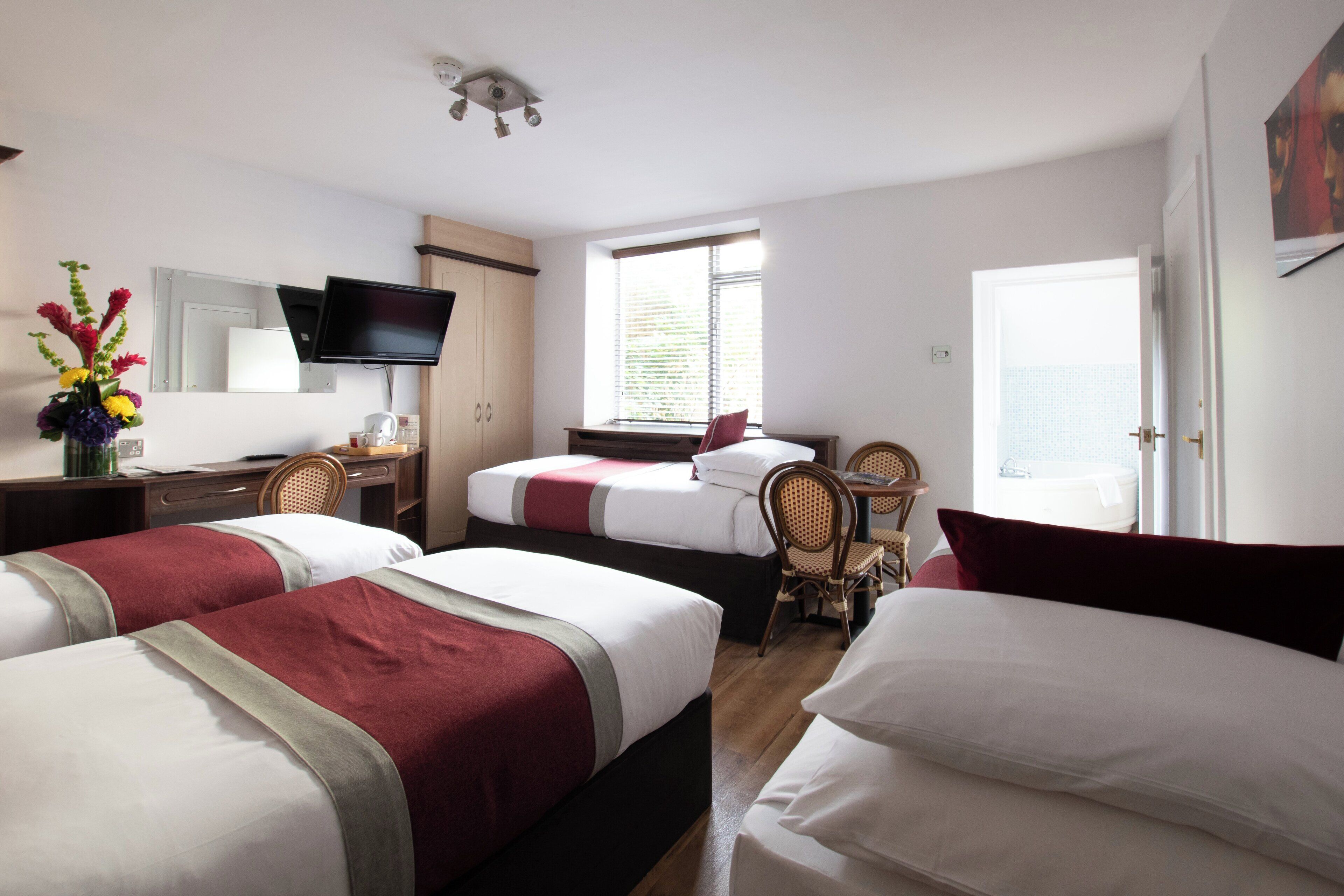 Triple Room | Select Comfort beds, in-room safe, desk, blackout drapes