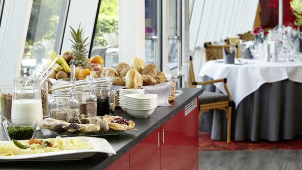 A breakfast buffet with various food items and beverages.
