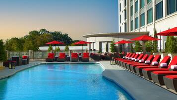 Outdoor pool, open 7:00 AM to 9:00 PM, pool umbrellas, sun loungers