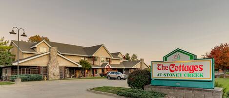 A building with a sign reading "The Cottages at Stoney Creek."