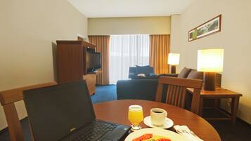 Junior Suite, 1 King Bed | In-room safe, desk, blackout curtains, iron/ironing board