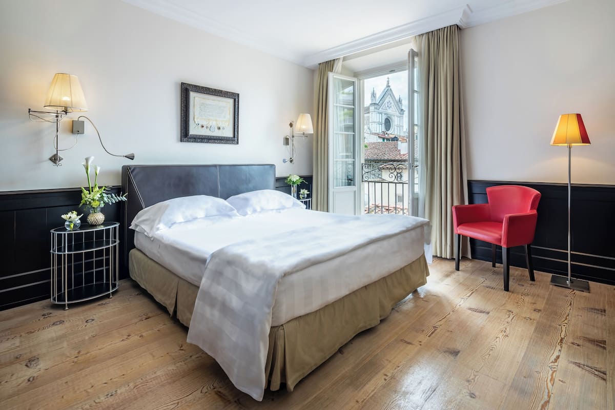 Deluxe Room | Premium bedding, minibar, in-room safe, individually decorated