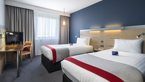 A hotel room with two beds, a desk, a TV, and a telephone. - Holiday Inn Express Leicester - City by IHG (Leicester)