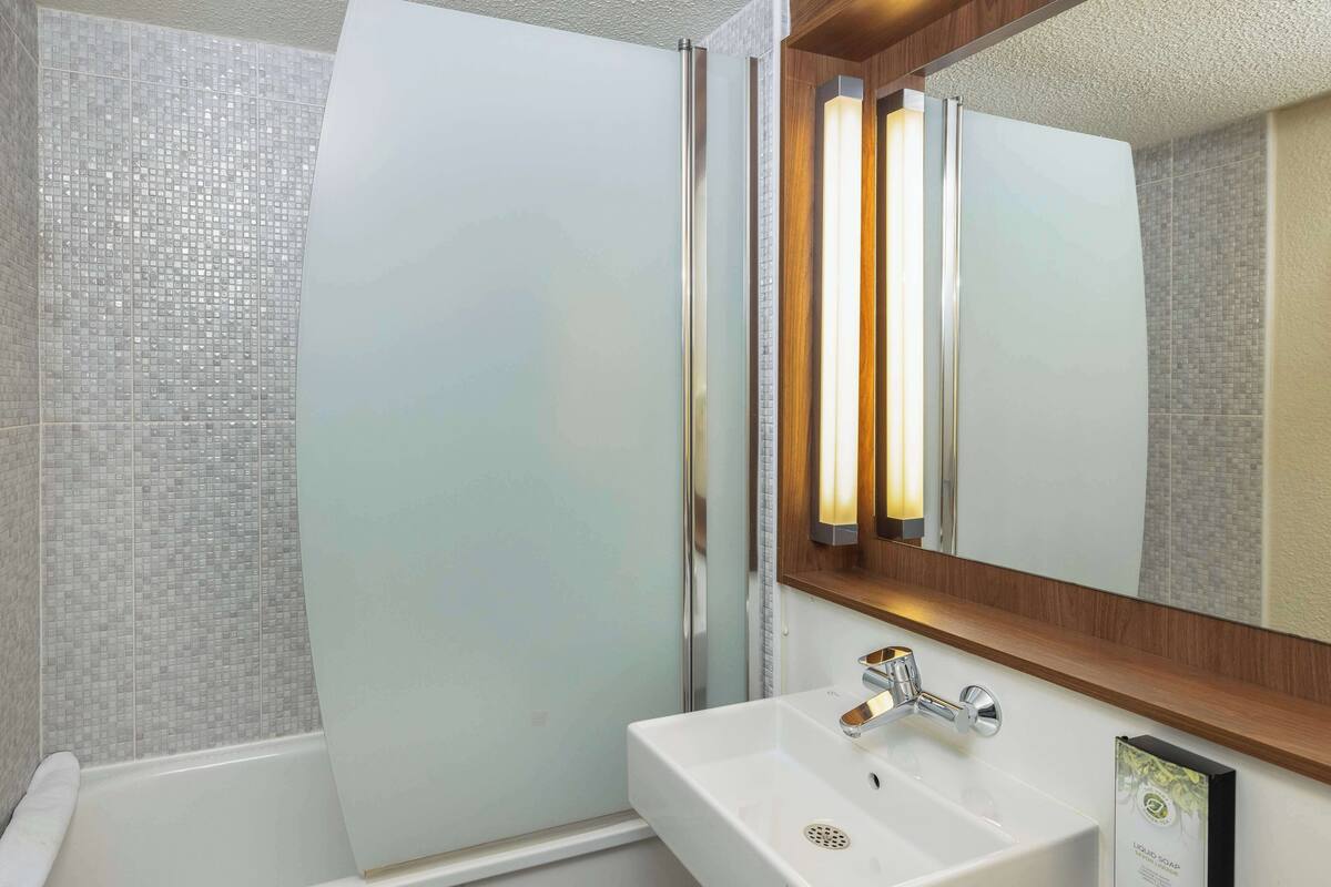 eco-friendly toiletries, hair dryer, towels