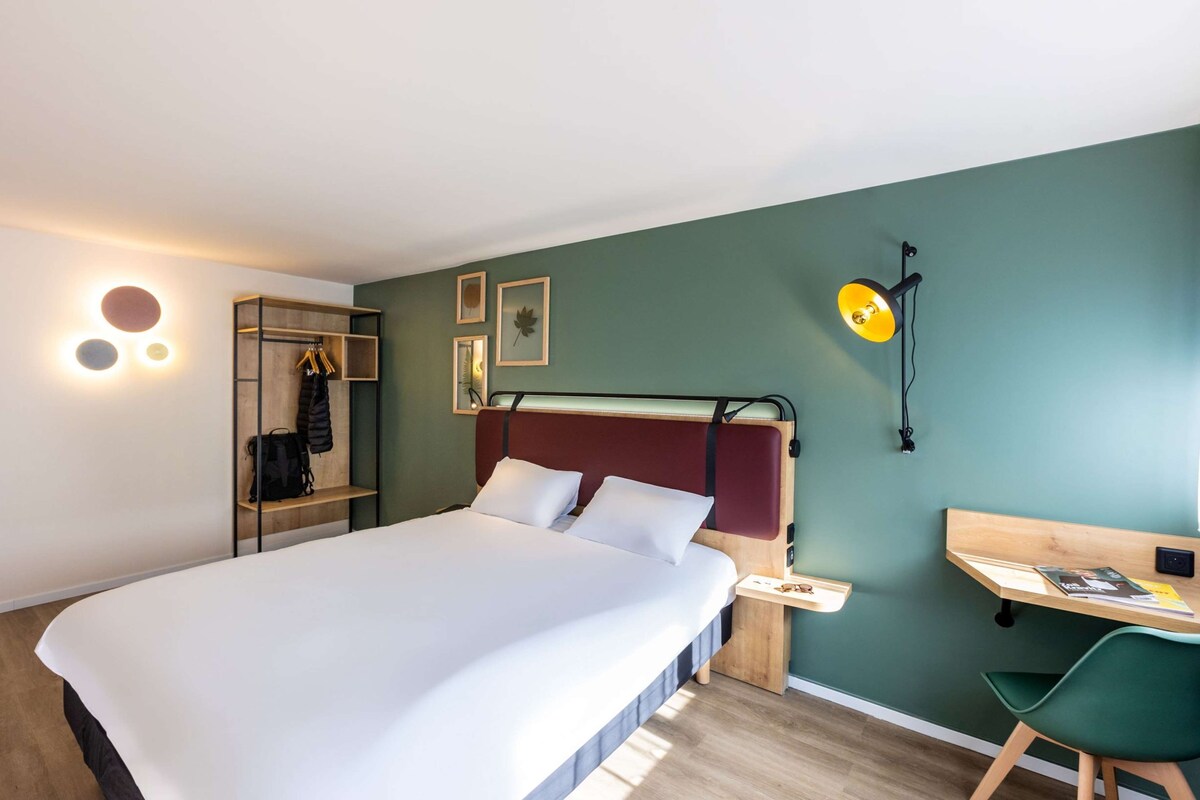 Premium bedding, desk, laptop workspace, blackout curtains