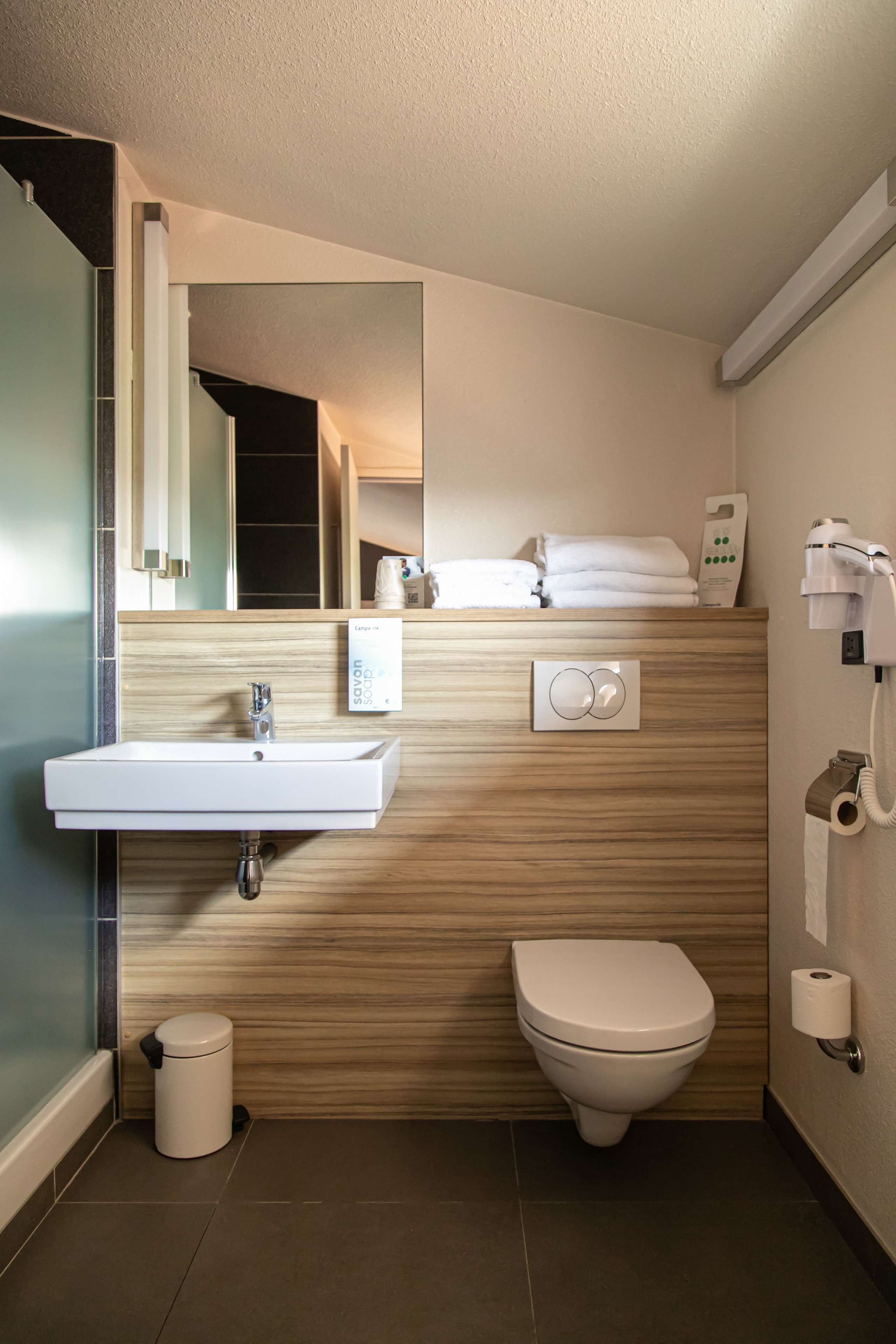 eco-friendly toiletries, hair dryer, towels