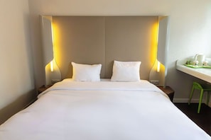Premium bedding, desk, laptop workspace, soundproofing