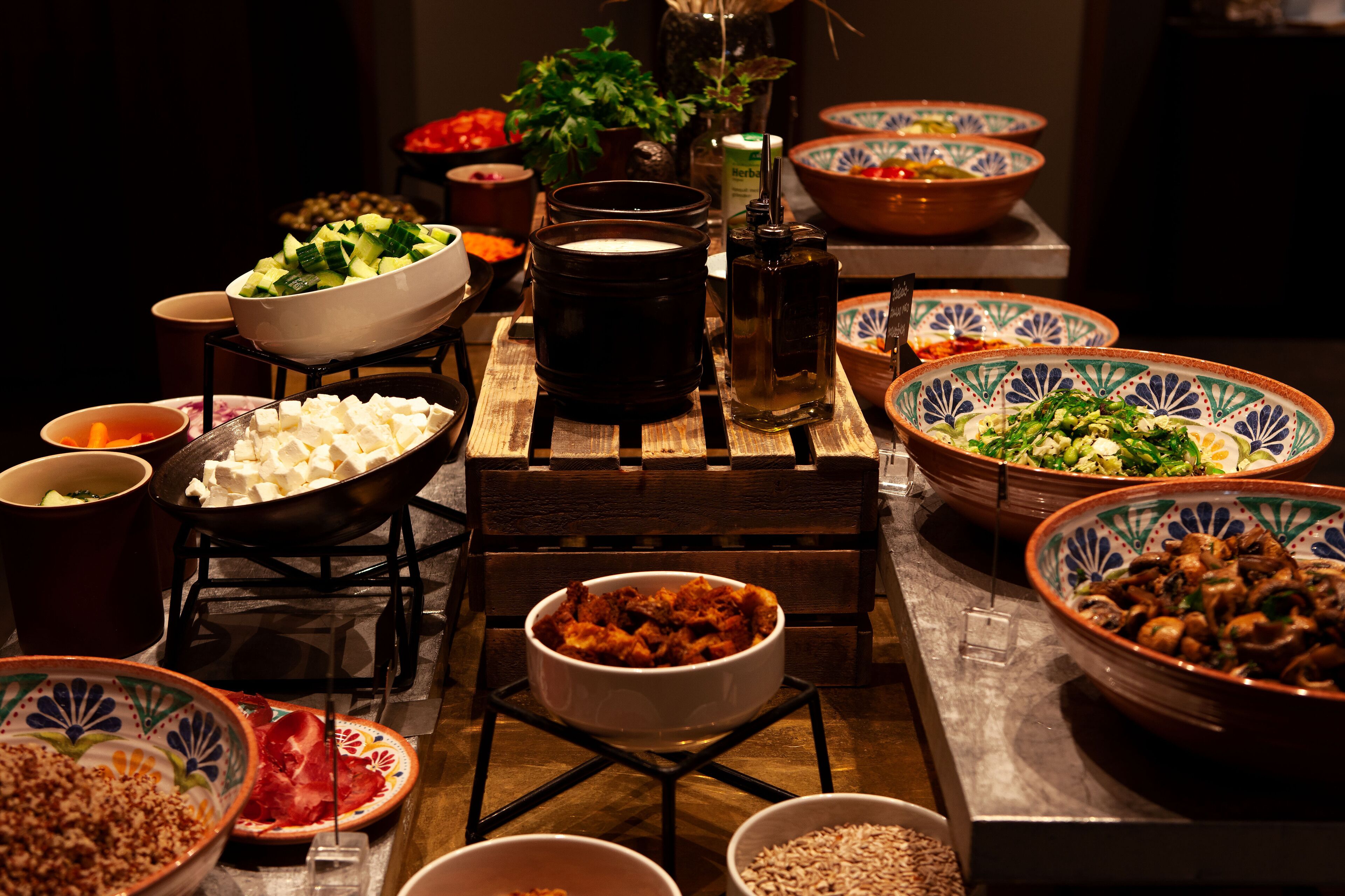 A table with various dishes and a candle.