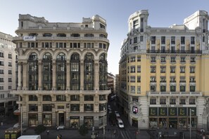 A historic building with ornate architecture, large windows, and a prominent entrance. - Petit Palace Triball (Madrid)