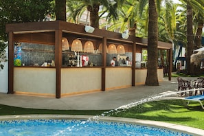 A poolside bar with a tiled backsplash, wooden beams, and a seating area with chairs. - Port Denia Hotel (Denia)