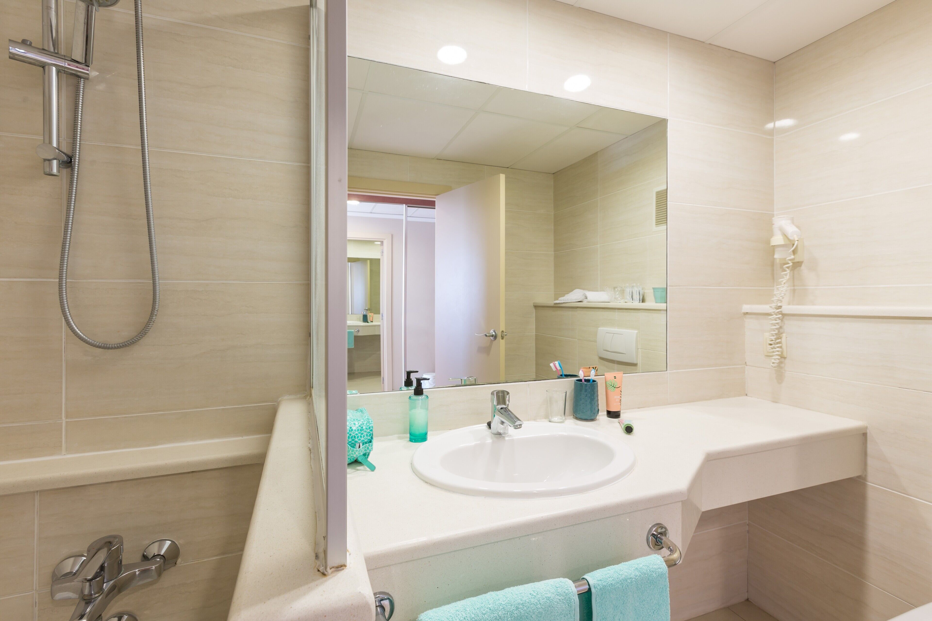 Bathroom | Hair dryer, towels, soap, shampoo