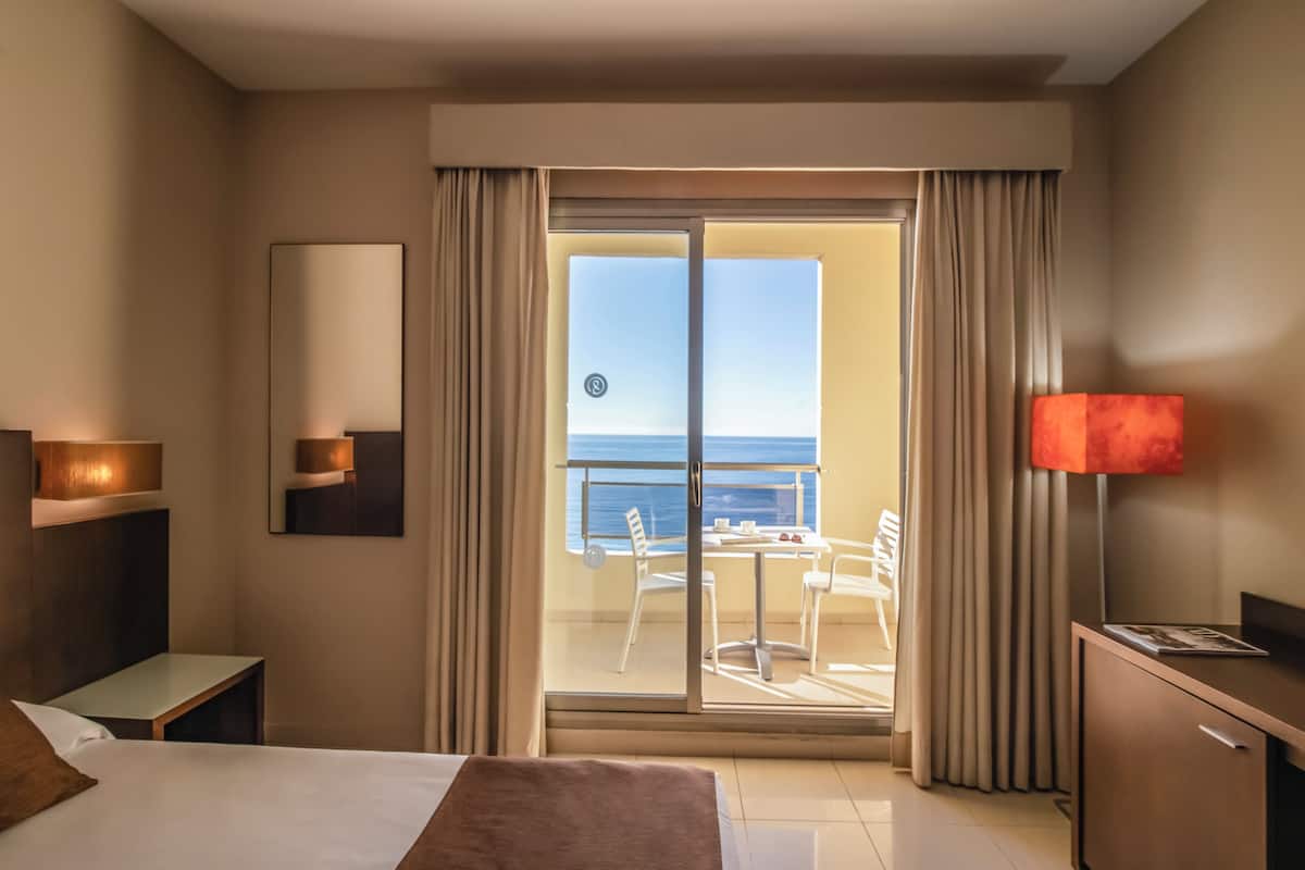 Double Room, Balcony, Ocean View | Minibar, in-room safe, desk, blackout drapes