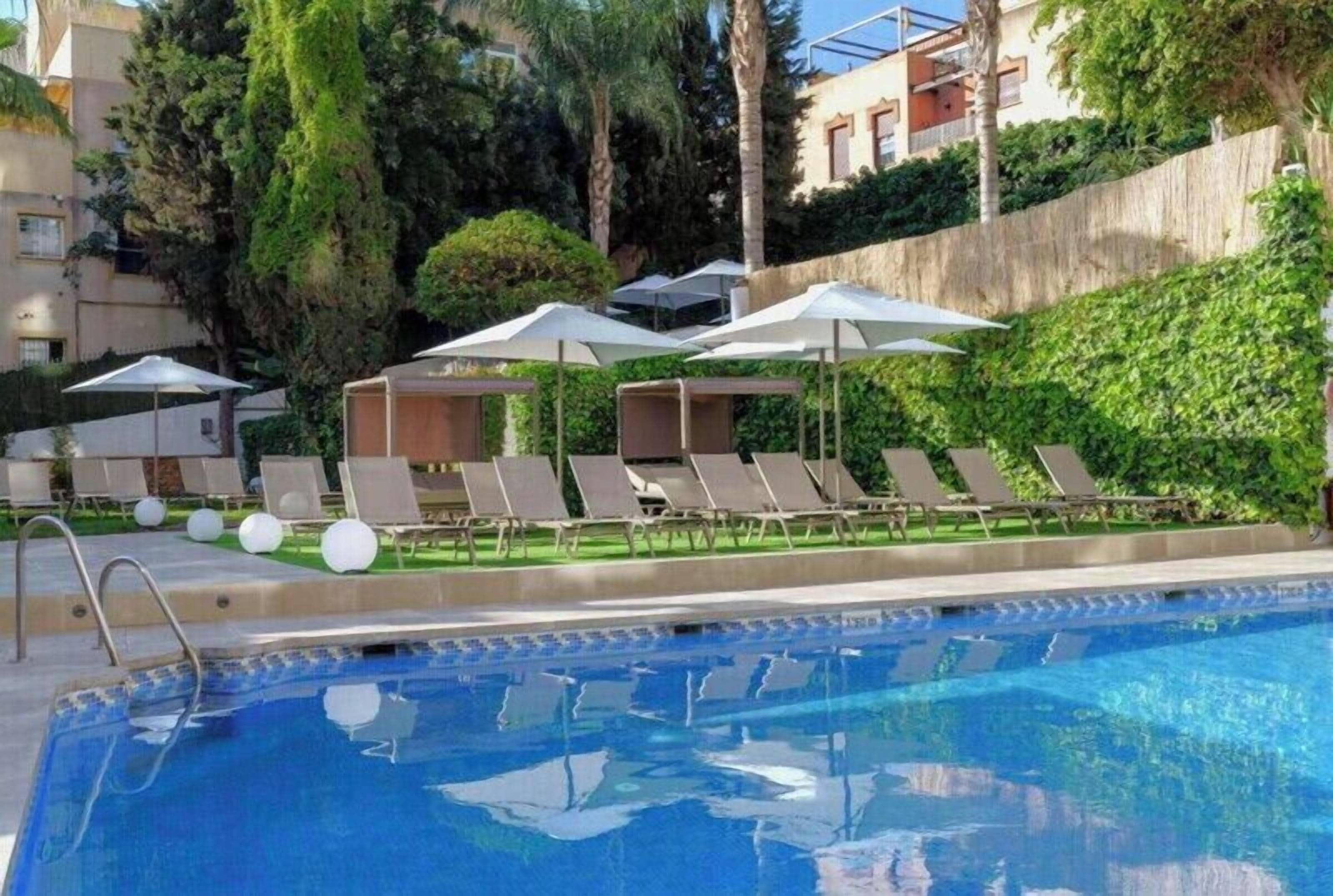 Outdoor pool, pool umbrellas, pool loungers