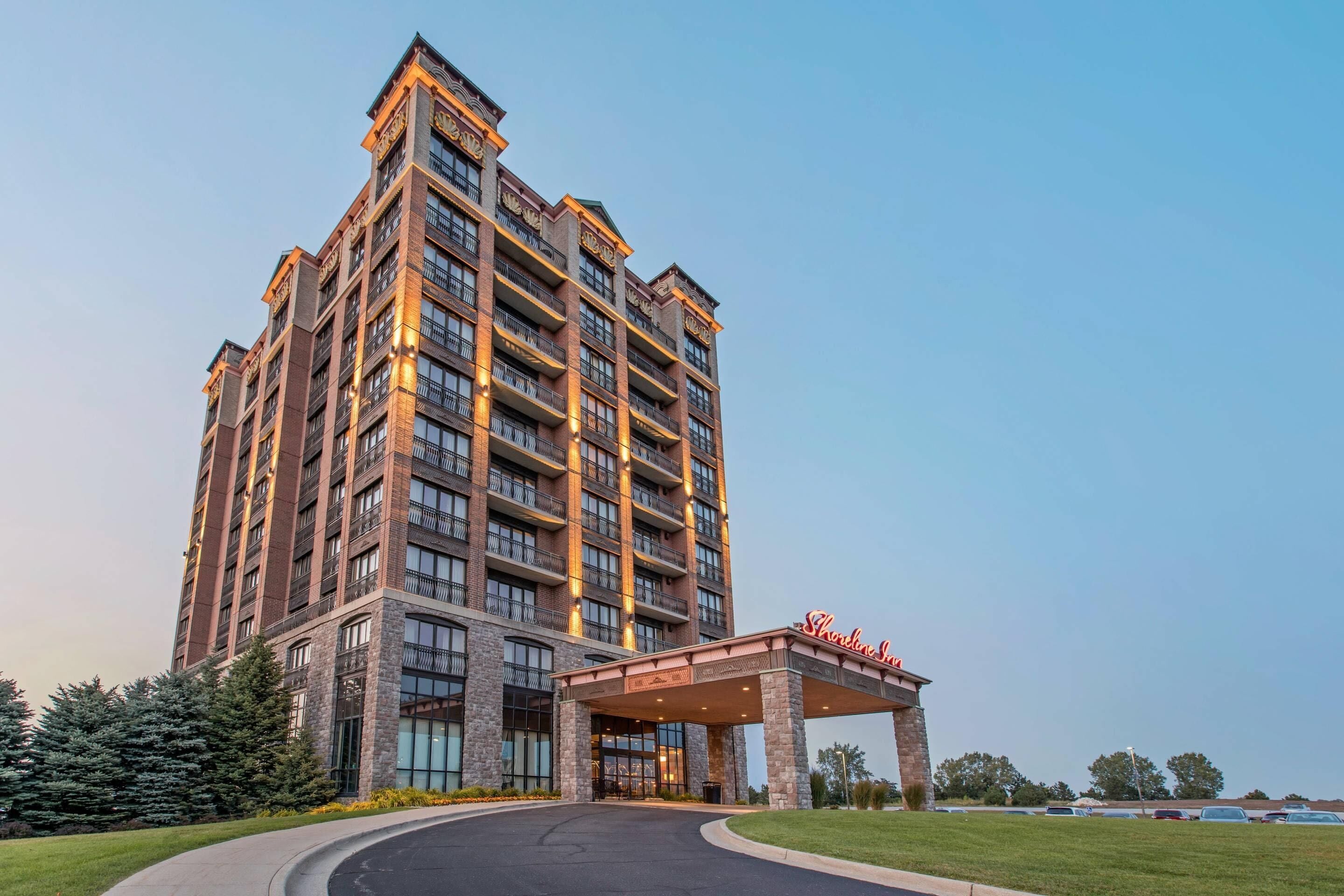 A multi-story hotel with a prominent entrance and a covered area.