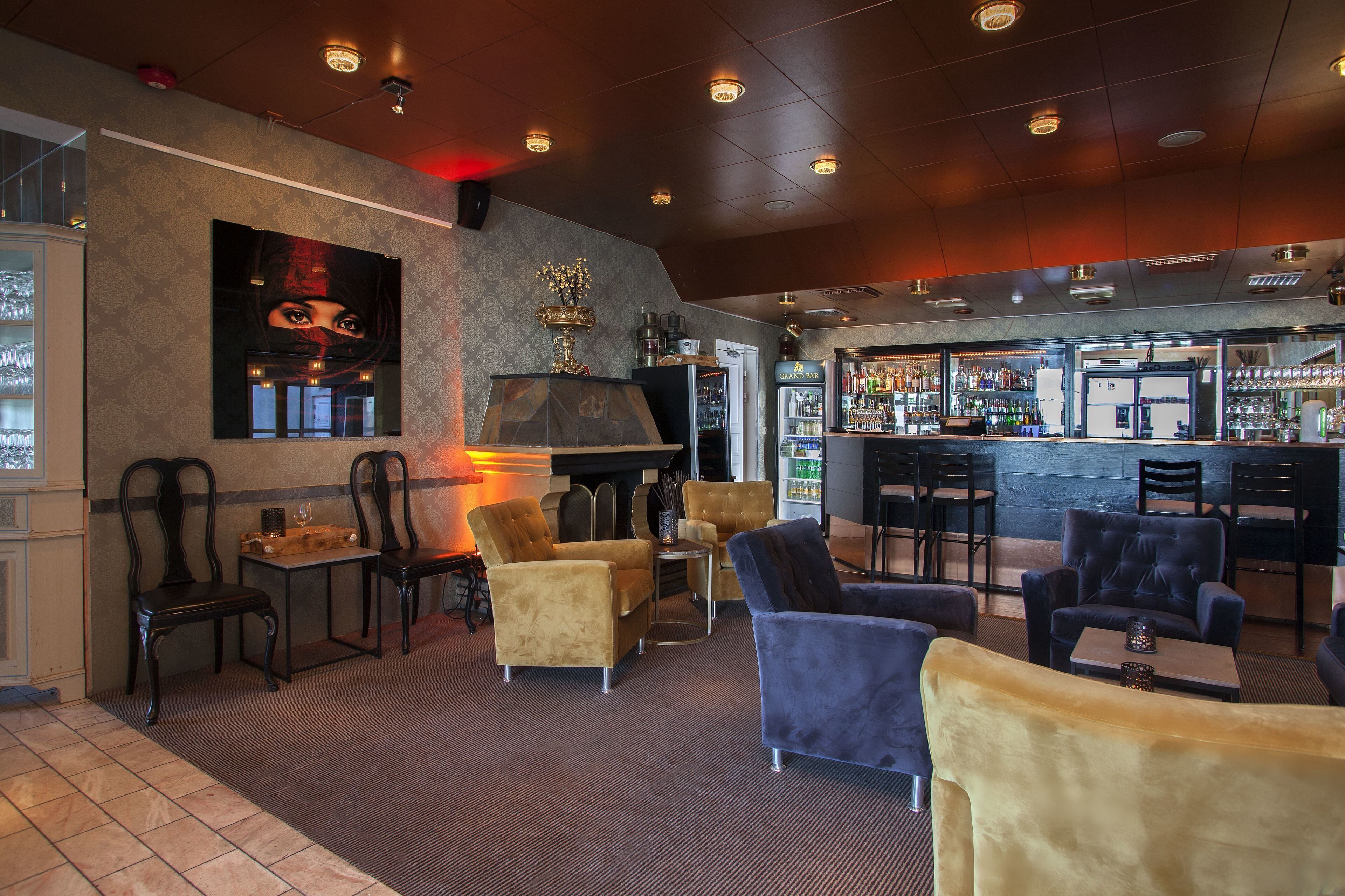 A bar area with seating and a bar counter.