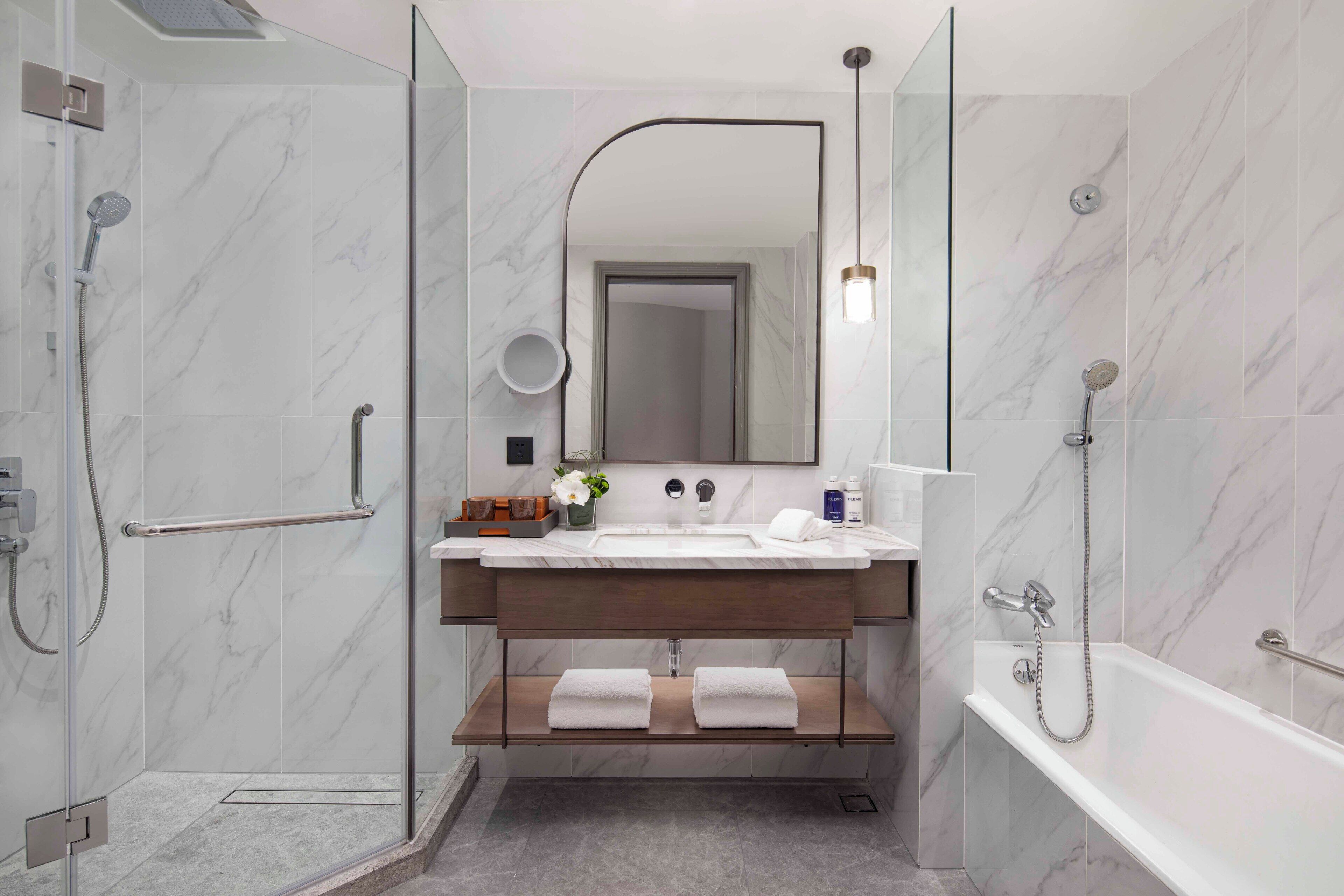 separate bathtub and shower, deep-soaking bathtub, rainfall showerhead