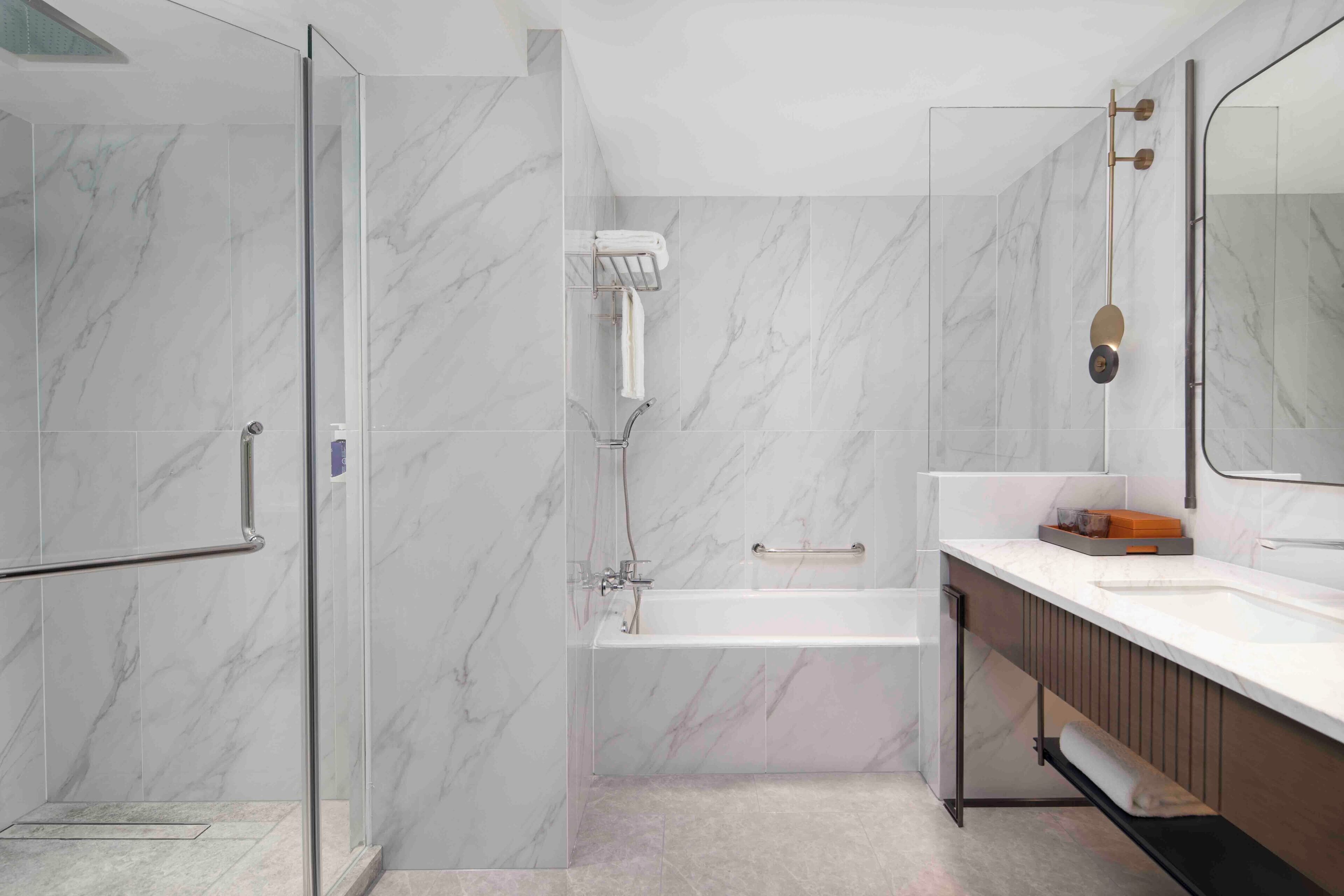 separate bathtub and shower, deep-soaking bathtub, rainfall showerhead