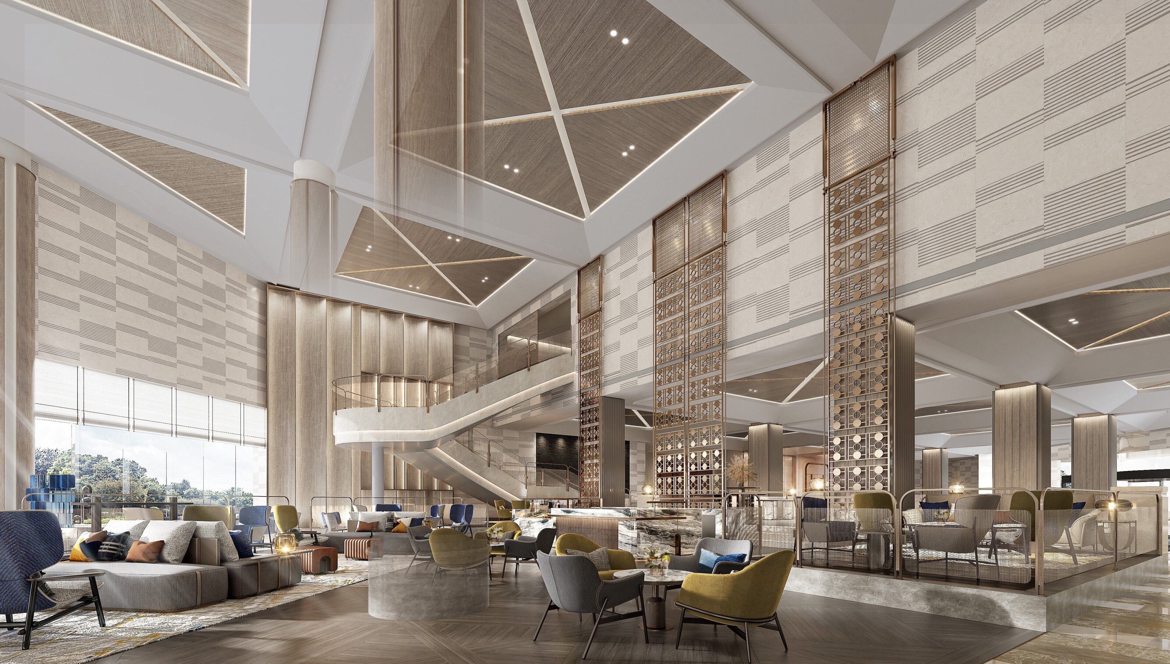 A spacious lobby with a central staircase, seating areas, and decorative panels.