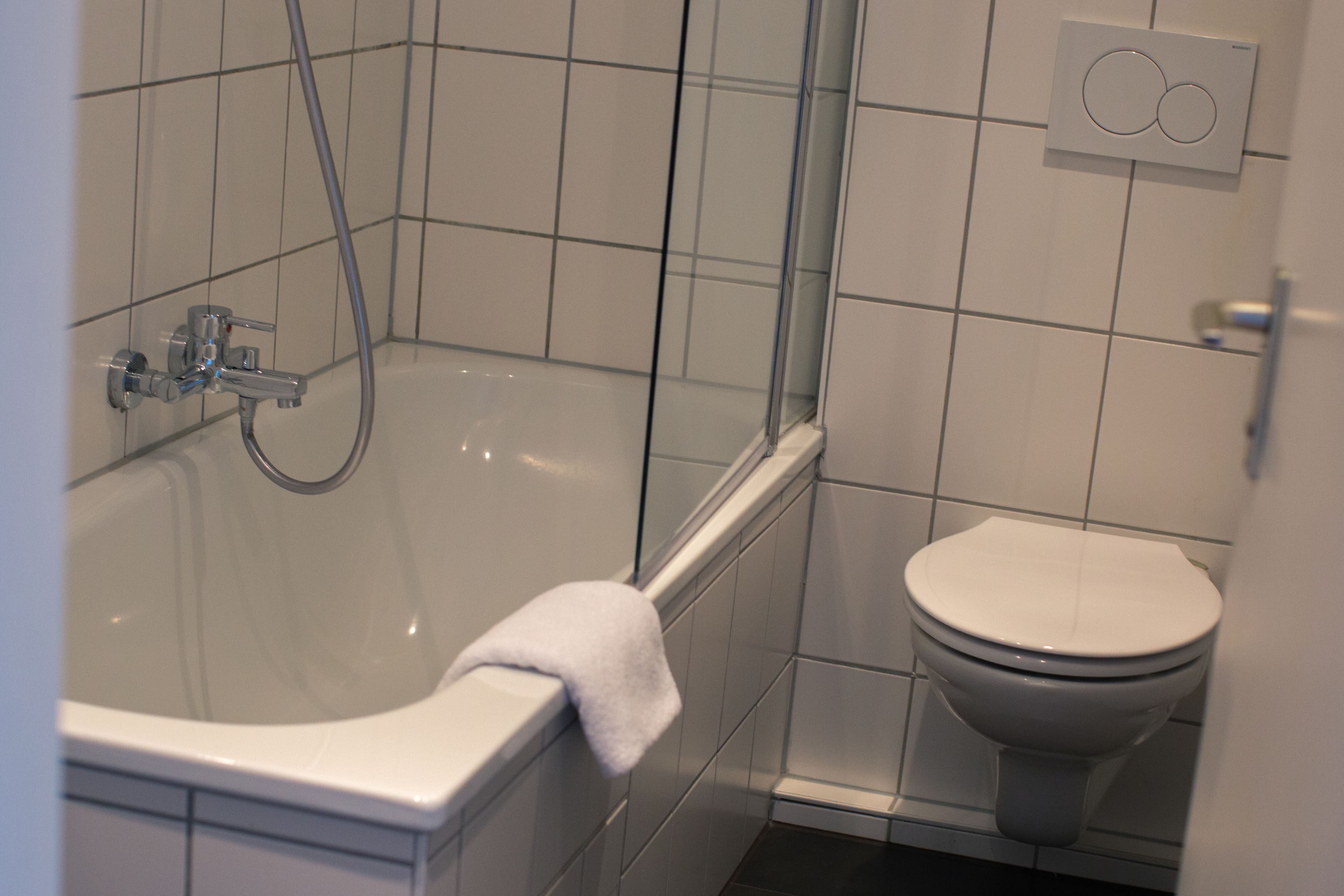 double room comfort courtyard area | bathroom | hair dryer, towels