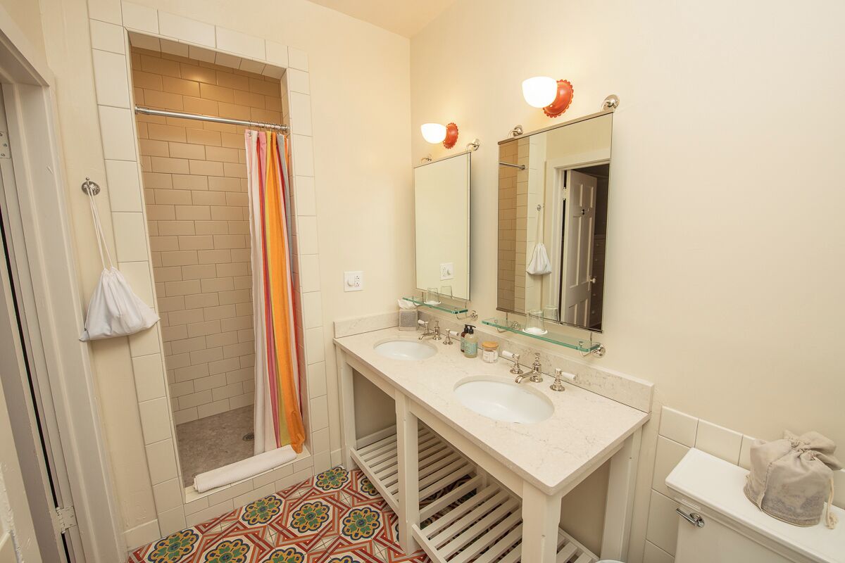 classic suite, 1 king bed | bathroom | eco-friendly toiletries, hair dryer, bathrobes, slippers
