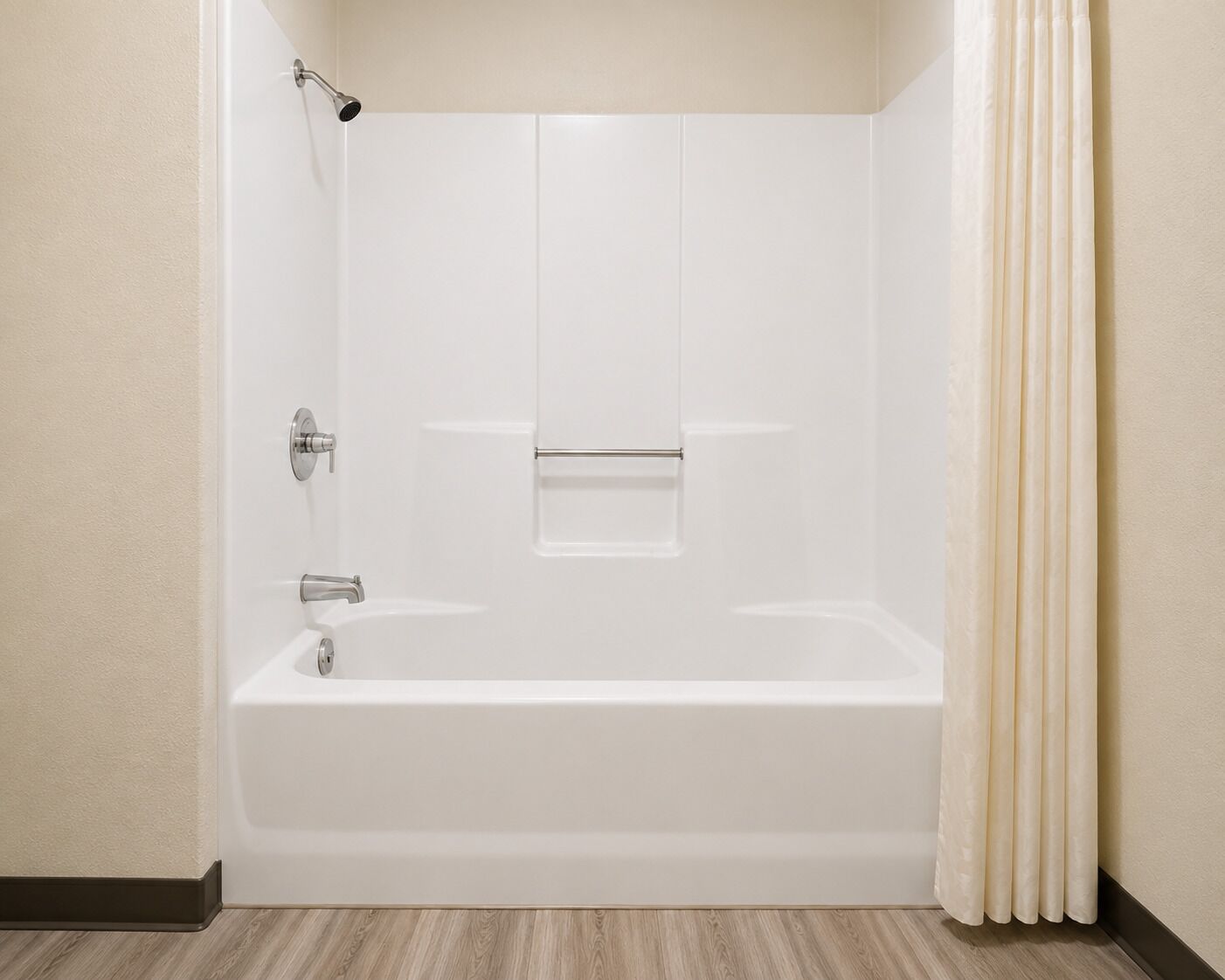 A standard hotel bathroom with a bathtub, shower, and toilet.