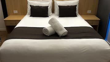 Deluxe Room | 1 bedroom, desk, blackout drapes, iron/ironing board