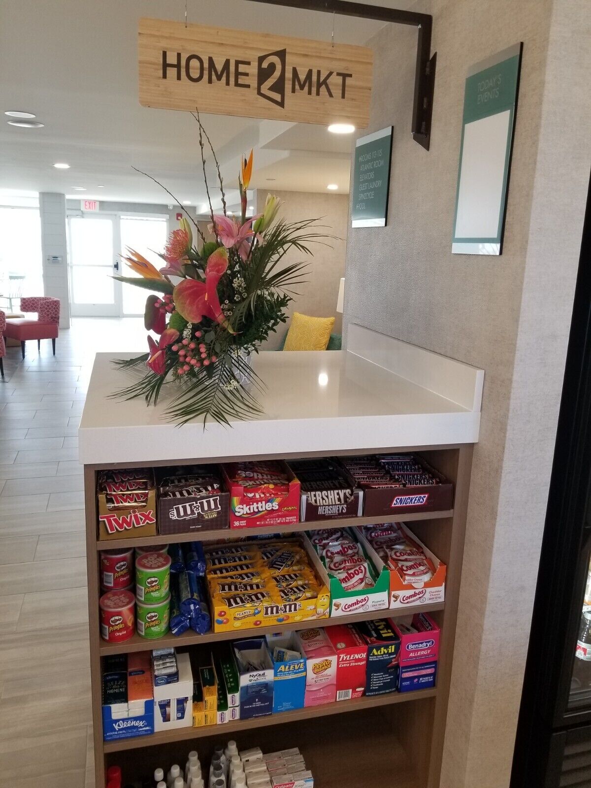 A Home2MKT display with a variety of snacks and toiletries.