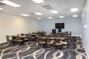 Conference room with a large table and comfortable seating for meetings.