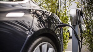 A black car parked at a charging station. - Pecan Tree Inn (Beaufort)