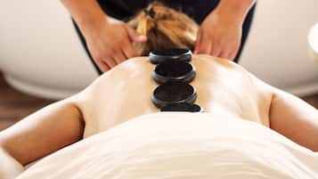 Experience a soothing massage on a comfortable massage table with a skilled therapist.