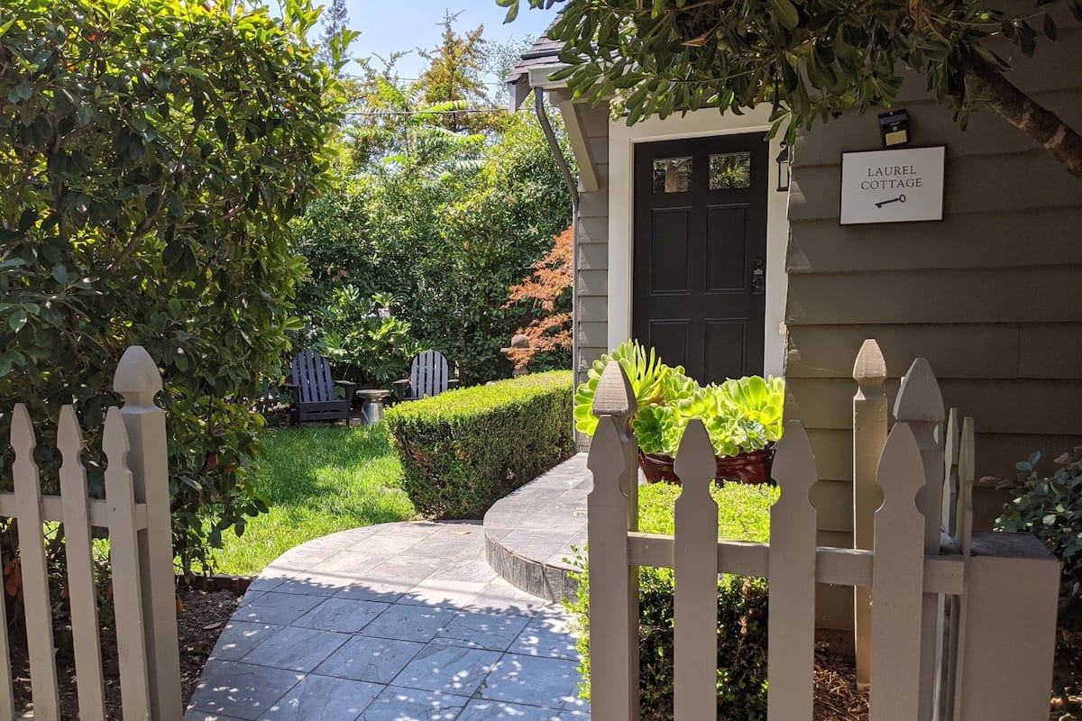 A gated entrance to a property with a sign reading "LAUREL COTTAGE".