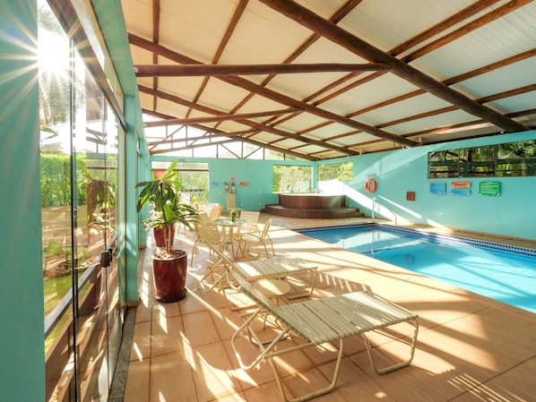 Indoor pool, outdoor pool, pool umbrellas