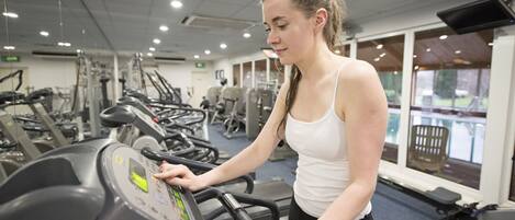 A gym with treadmills and exercise equipment.
