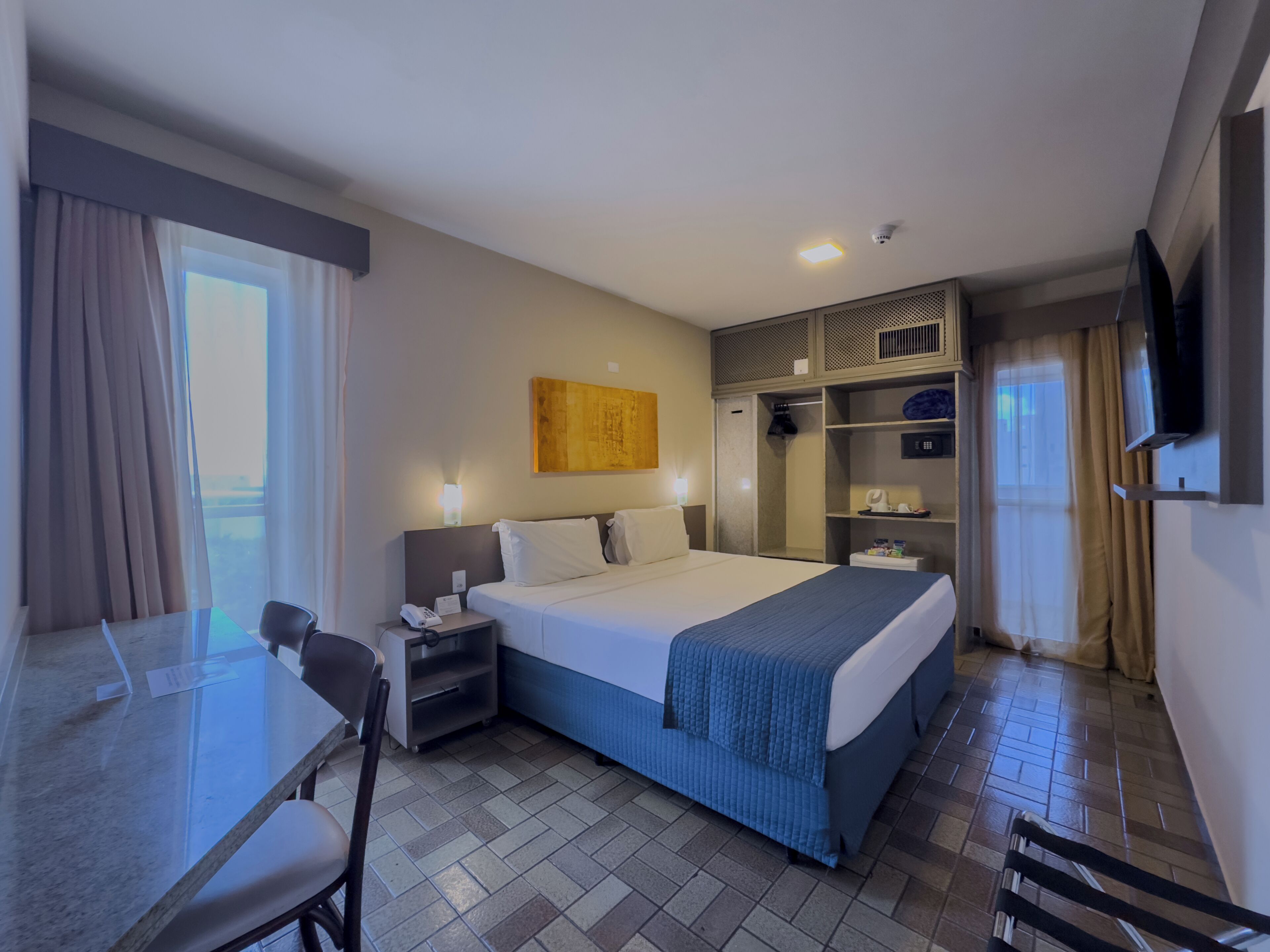 Superior Family Room | Minibar, in-room safe, desk, laptop workspace