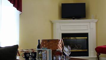 Room (210 Luxury) | Living area | TV, fireplace