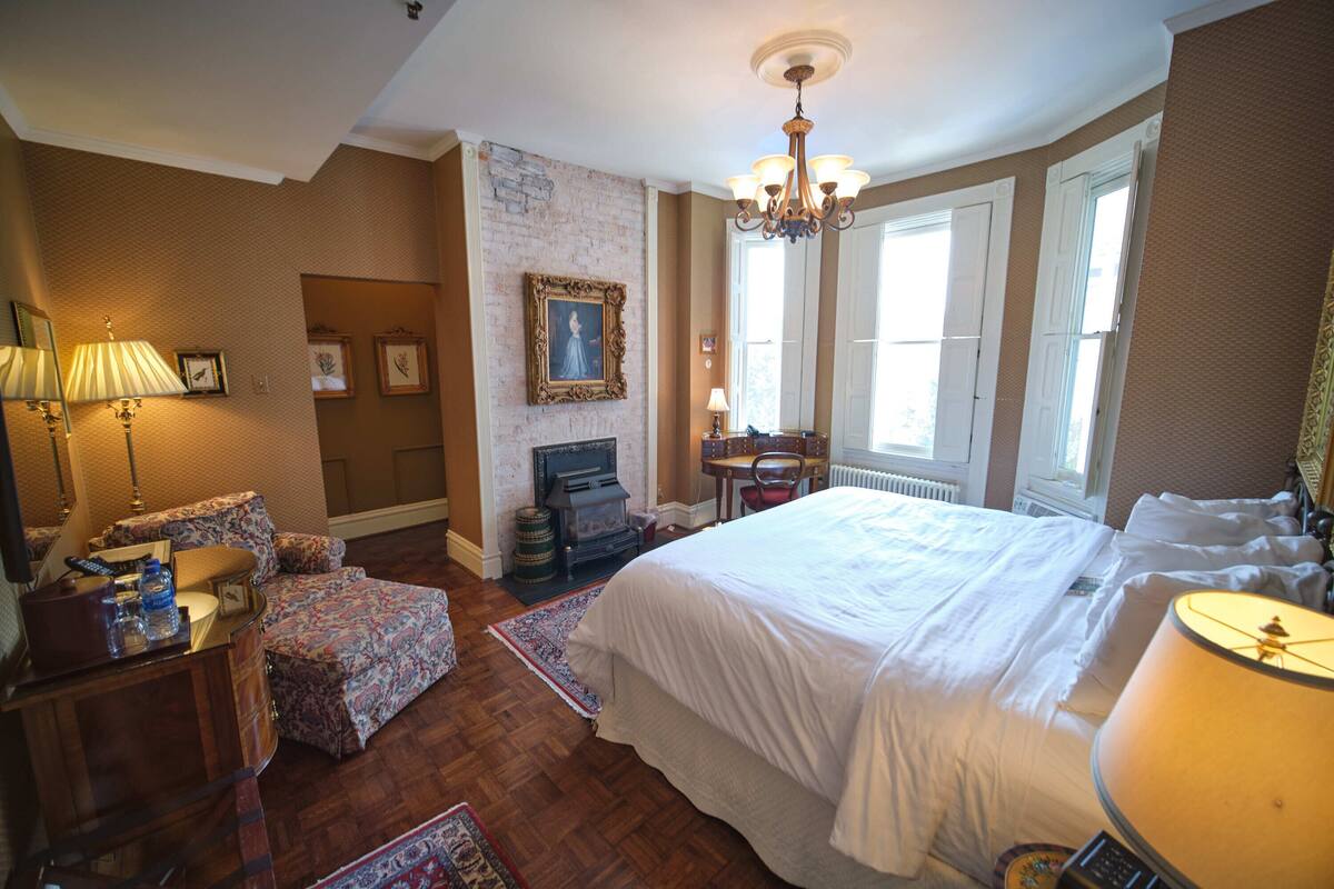 The Arkansas Black Room | Premium bedding, desk, laptop workspace, blackout drapes