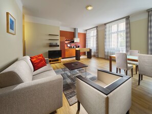 Business Suite, 1 Bedroom | Living area | 80-cm LCD TV with cable channels, TV, DVD player