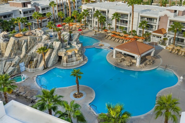 2 outdoor pools, open 8:00 AM to 10:00 PM, pool umbrellas, pool loungers