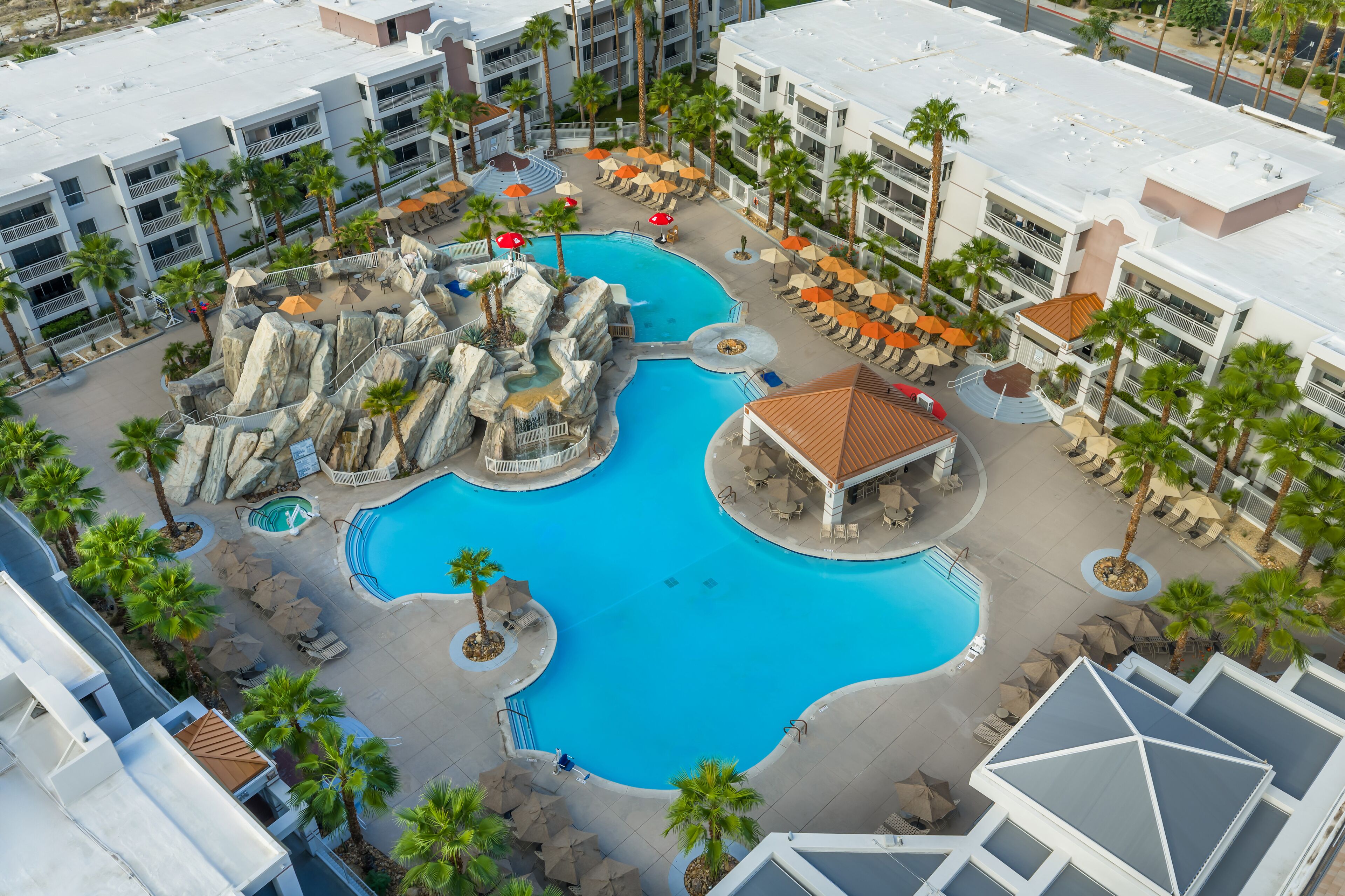 2 outdoor pools, open 8:00 AM to 10:00 PM, pool umbrellas, pool loungers